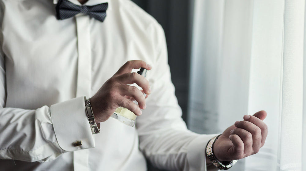 Man Spraying Perfume