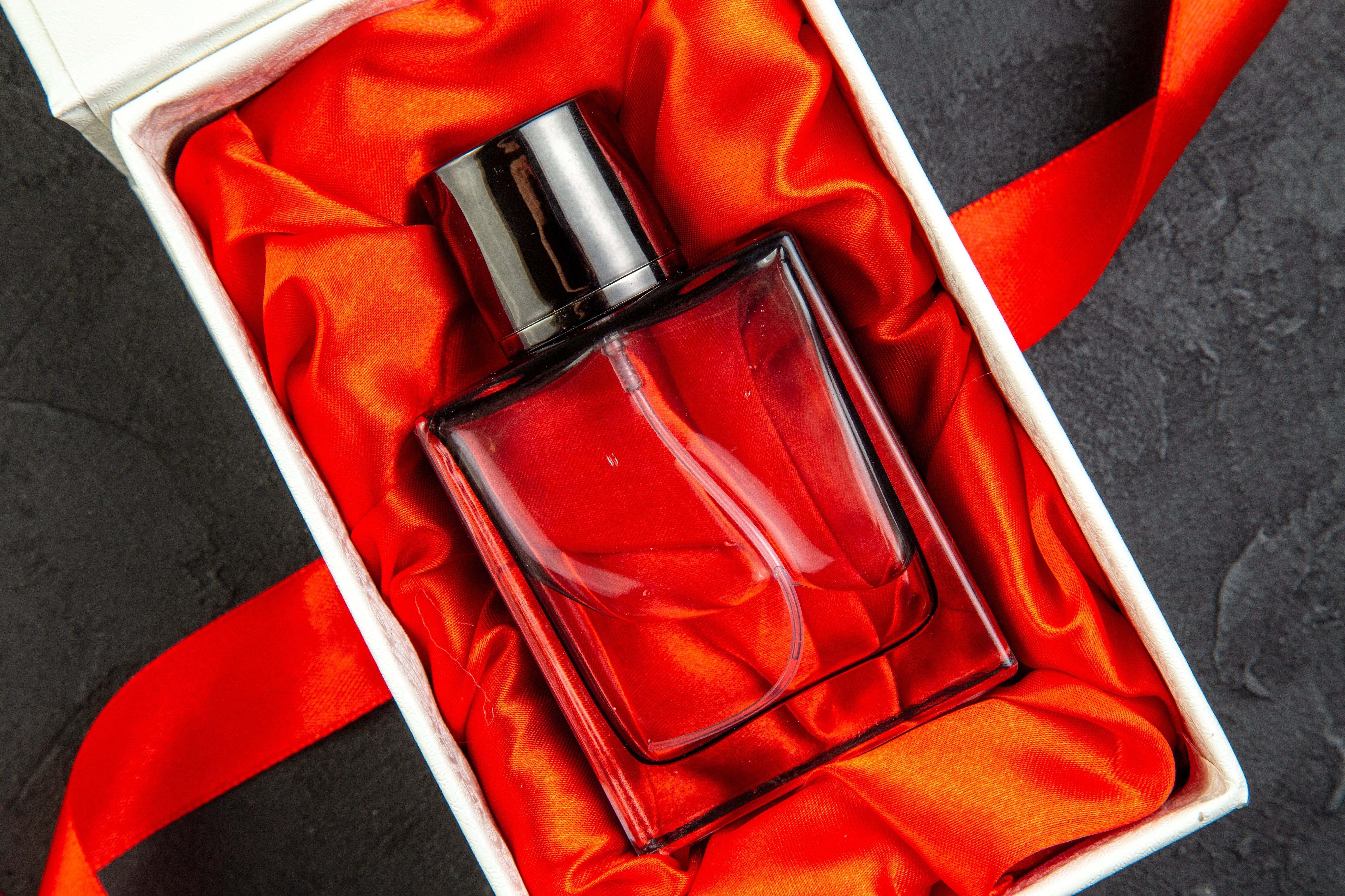 Elegantly packaged clear perfume bottle.