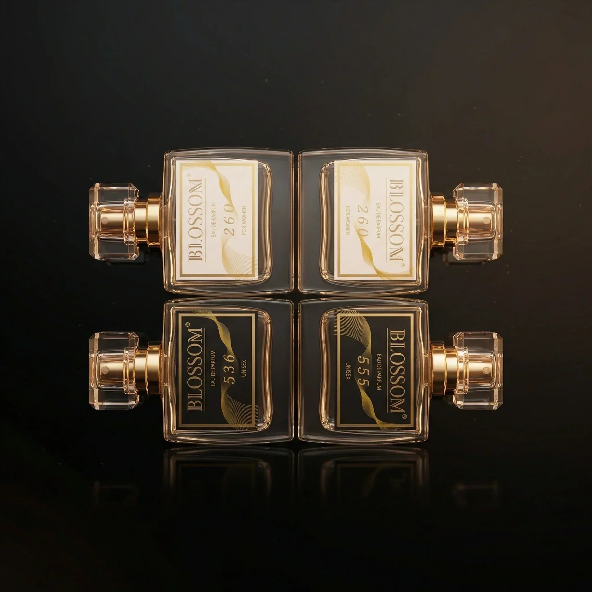 Blossom Perfumery perfume dupes on a dark, dimly highlighted background. The labeling along with the background creates a sense of luxury. 